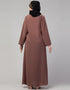 Trendy Abaya made from Nida fabric with a flared hem for a feminine touch In Color Light brown